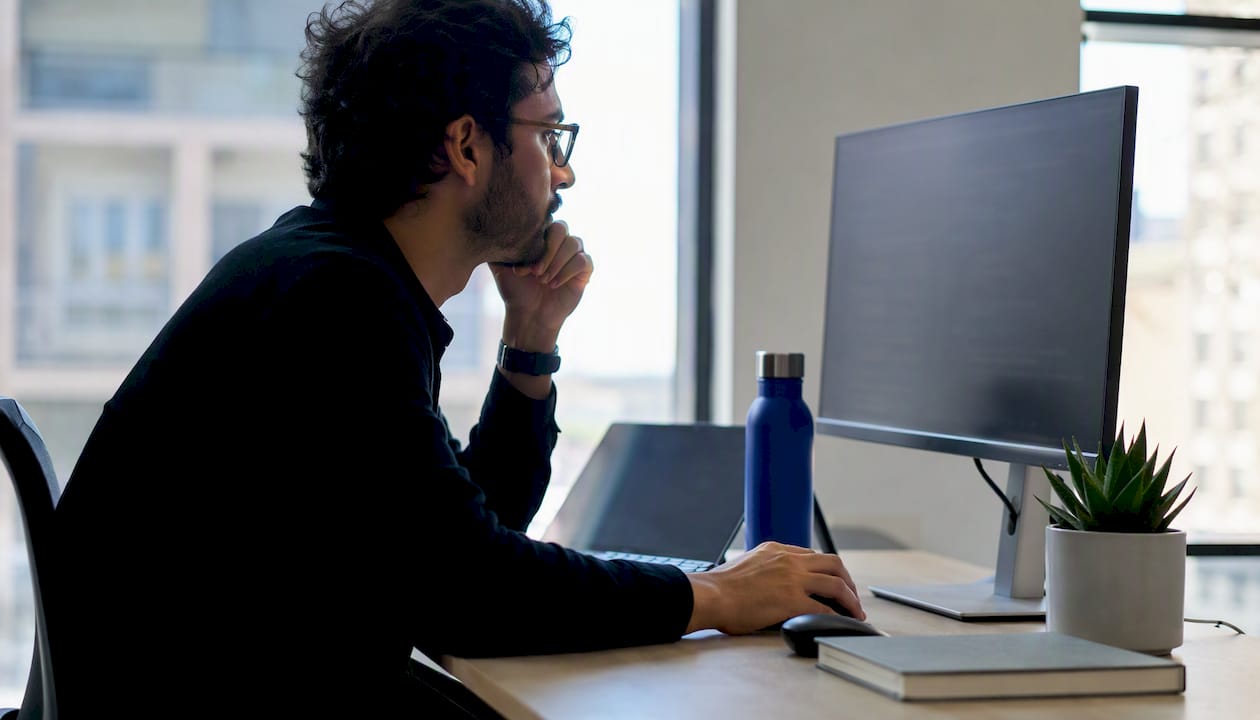 Engineer inspecting AI code on screen